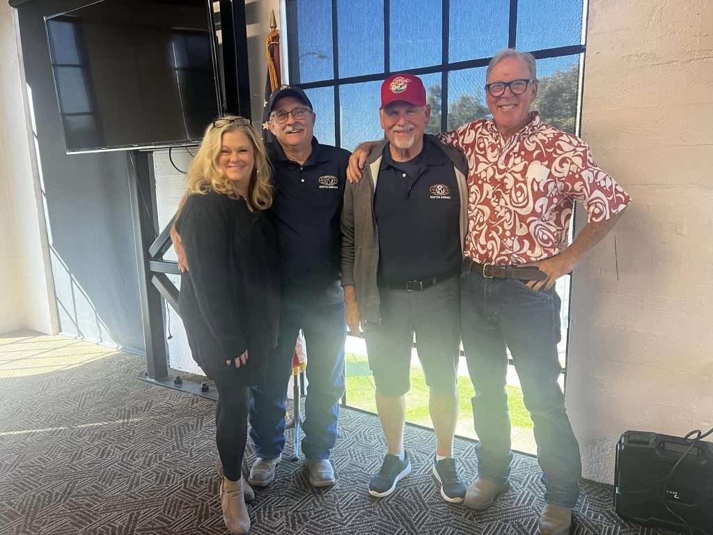 Four Exeter Kiwanis members together at a club event